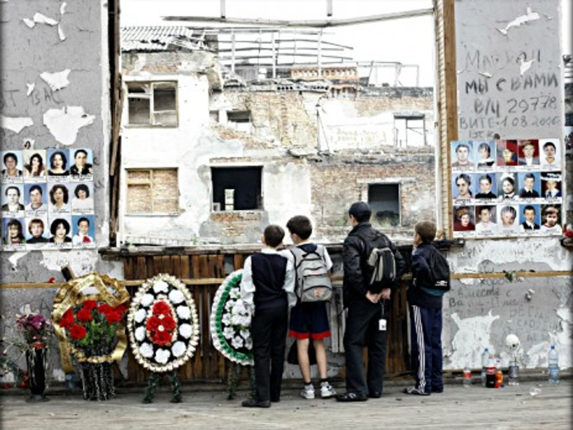 Russian schoolboys standing where the Beslan hostage crisis took placeon Sept.1, 2004