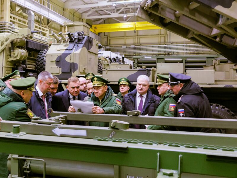 Russia's Defence Minister Sergei Shoigu (C) visits one of the regional defence industry enterprises to inspect the fulfilment of a state defence order