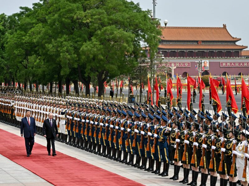 Russia's President Vladimir Putin and China's President Xi Jinping attend an official welcoming ceremony in front of the Great Hall of the People in Tiananmen Square.