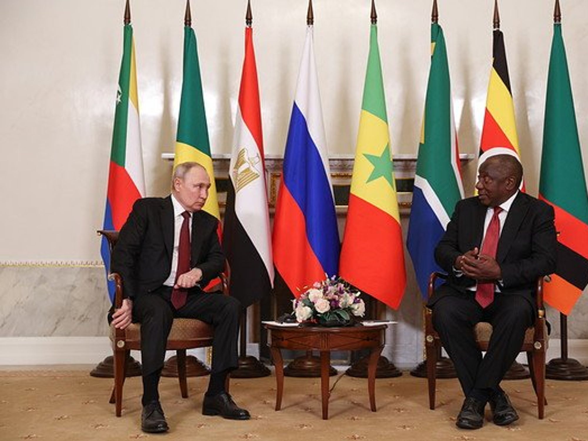 Russia's President Vladimir Putin and South Africa's President Cyril Ramaphosa sitting next to each other.