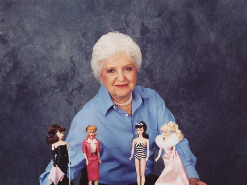 Ruth Handler, creator of the Barbie doll, with Barbie dolls.