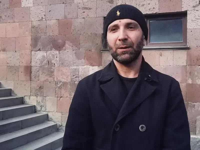 SALMAN MUKAEV AT THE COURTHOUSE.