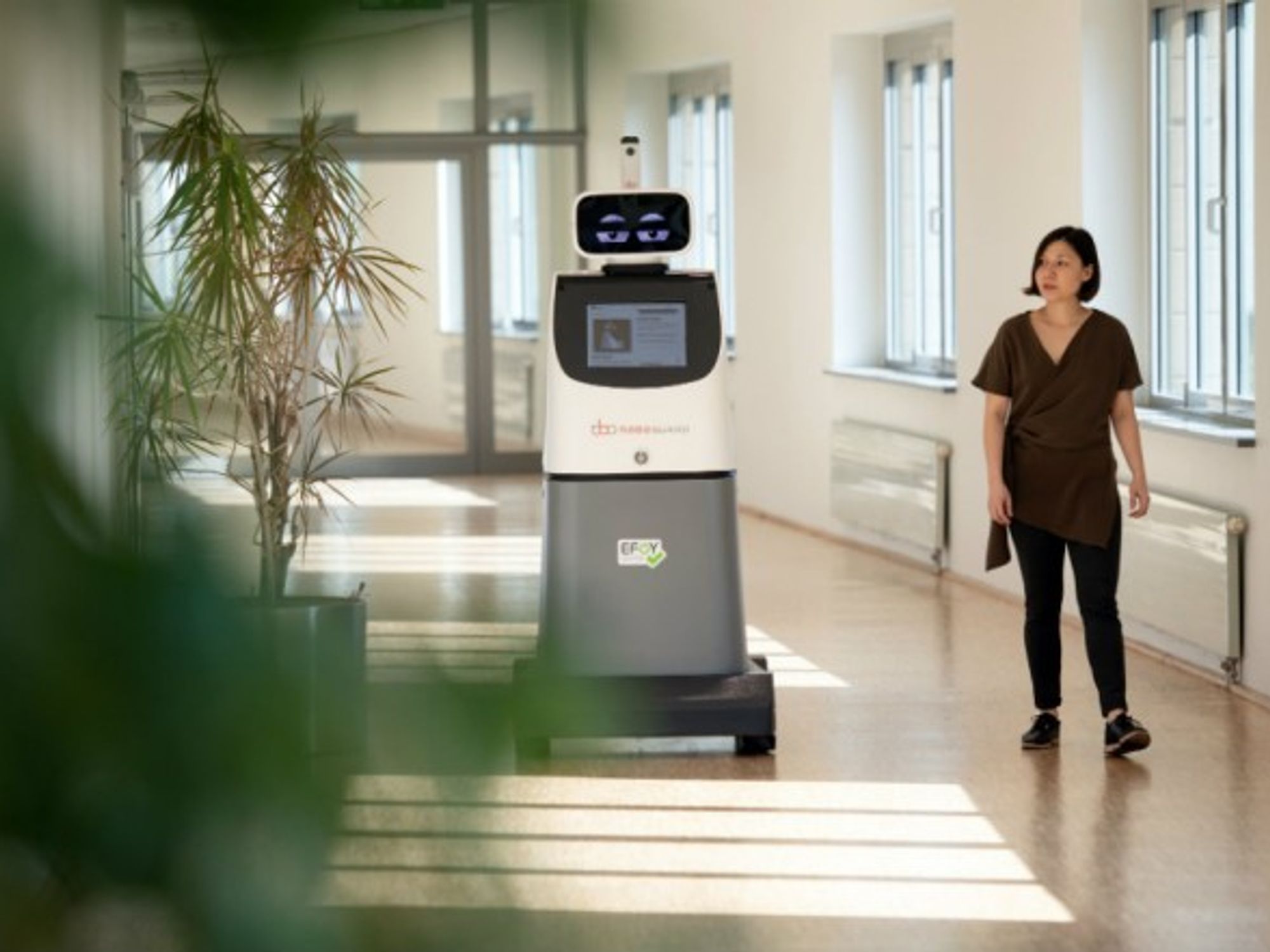 Sara Pereira passes the security robot ''Roboguard'' at a press conference for a security fair, on Sept. 20.