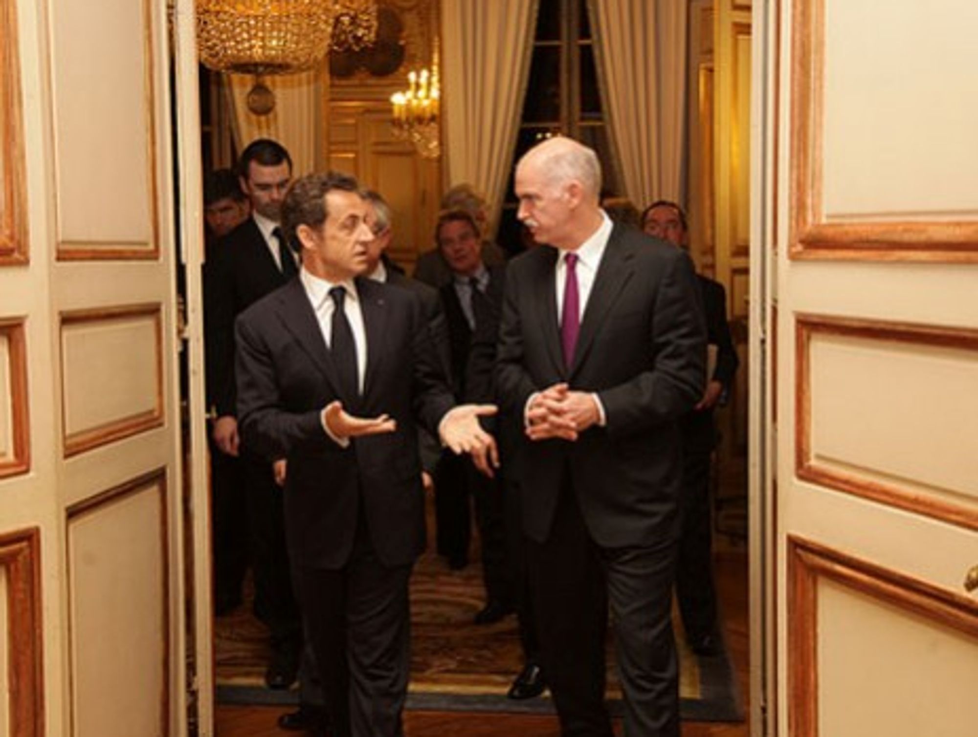 Sarkozy, shown with the Greek Prime Minister Papandreou, likes to mingle with French intellectuals.