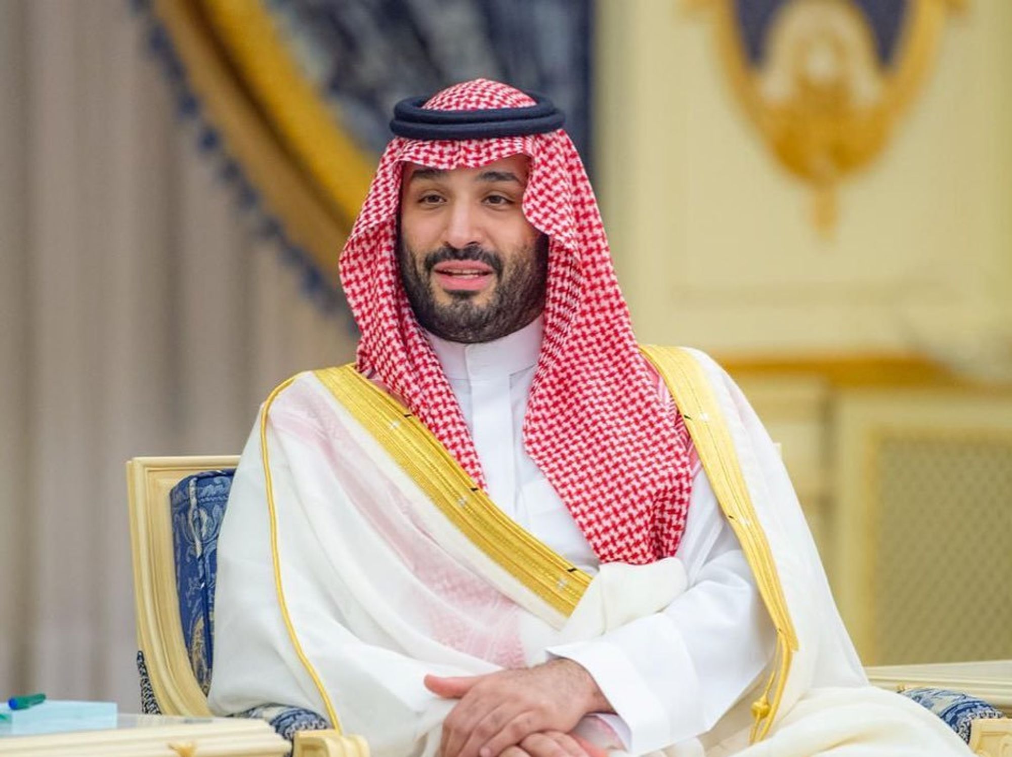 Saudi Crown Prince Mohammed bin Salman sitting with hands crossed