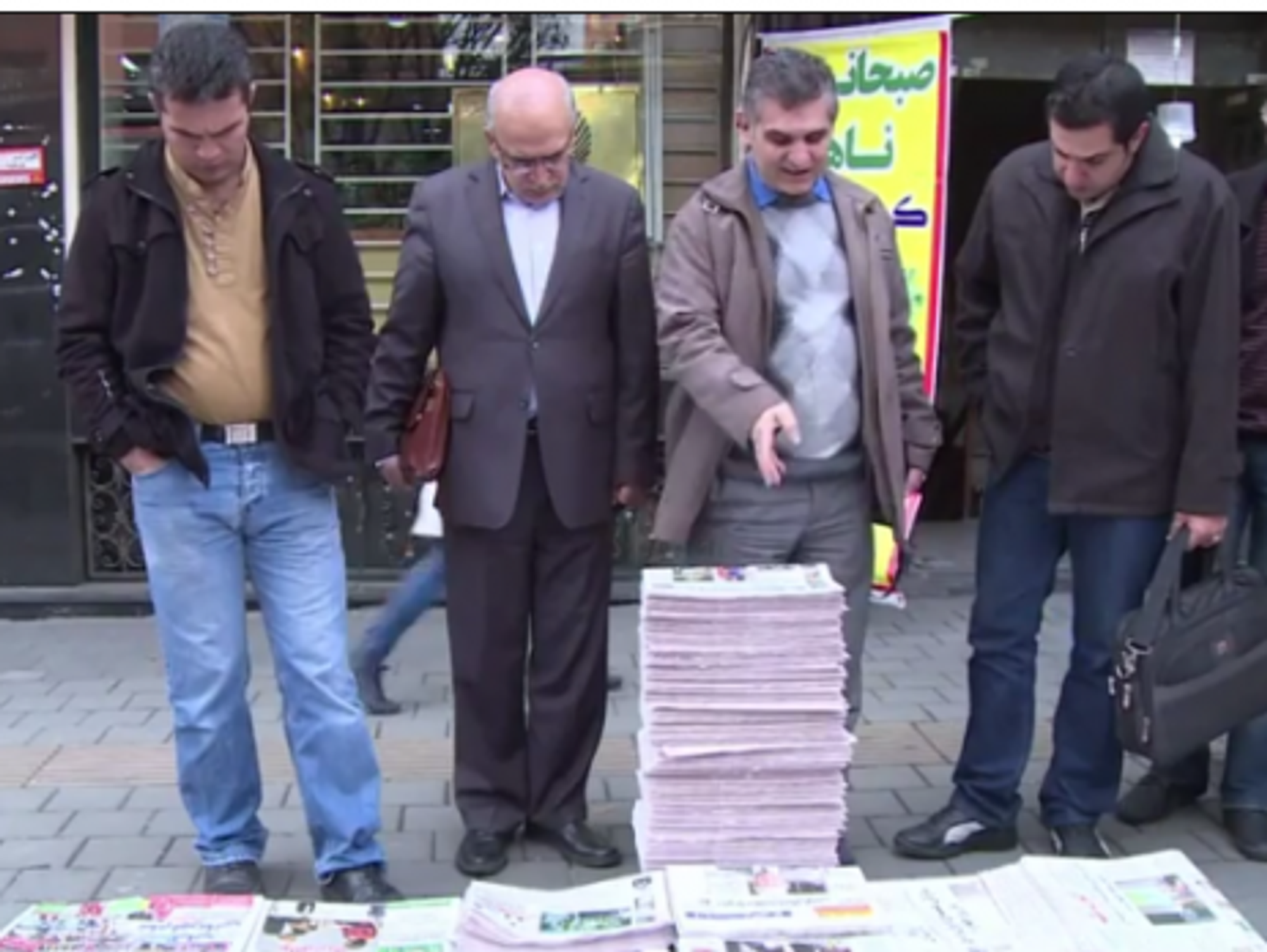 Scanning the news in Tehran