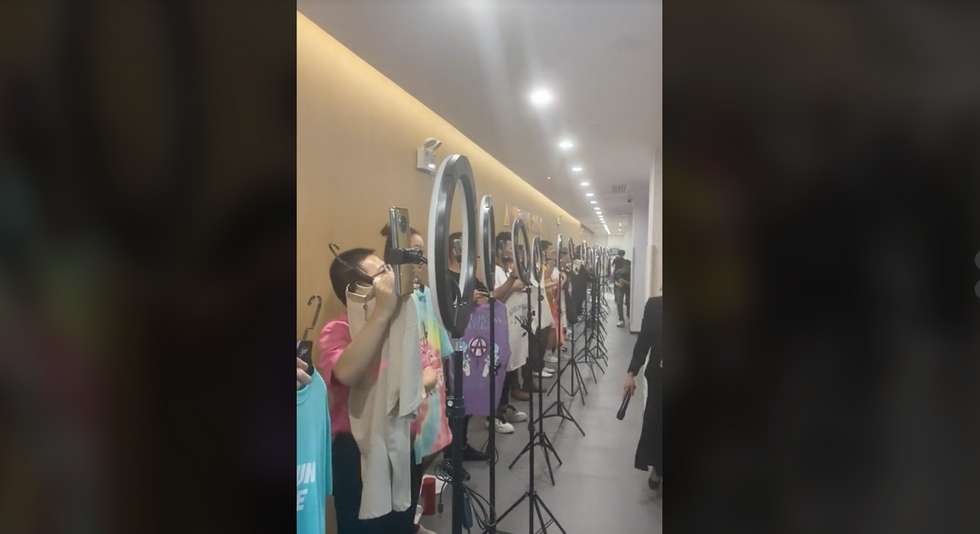 Screenshot from TikTok video where streamers line up to show off their products.