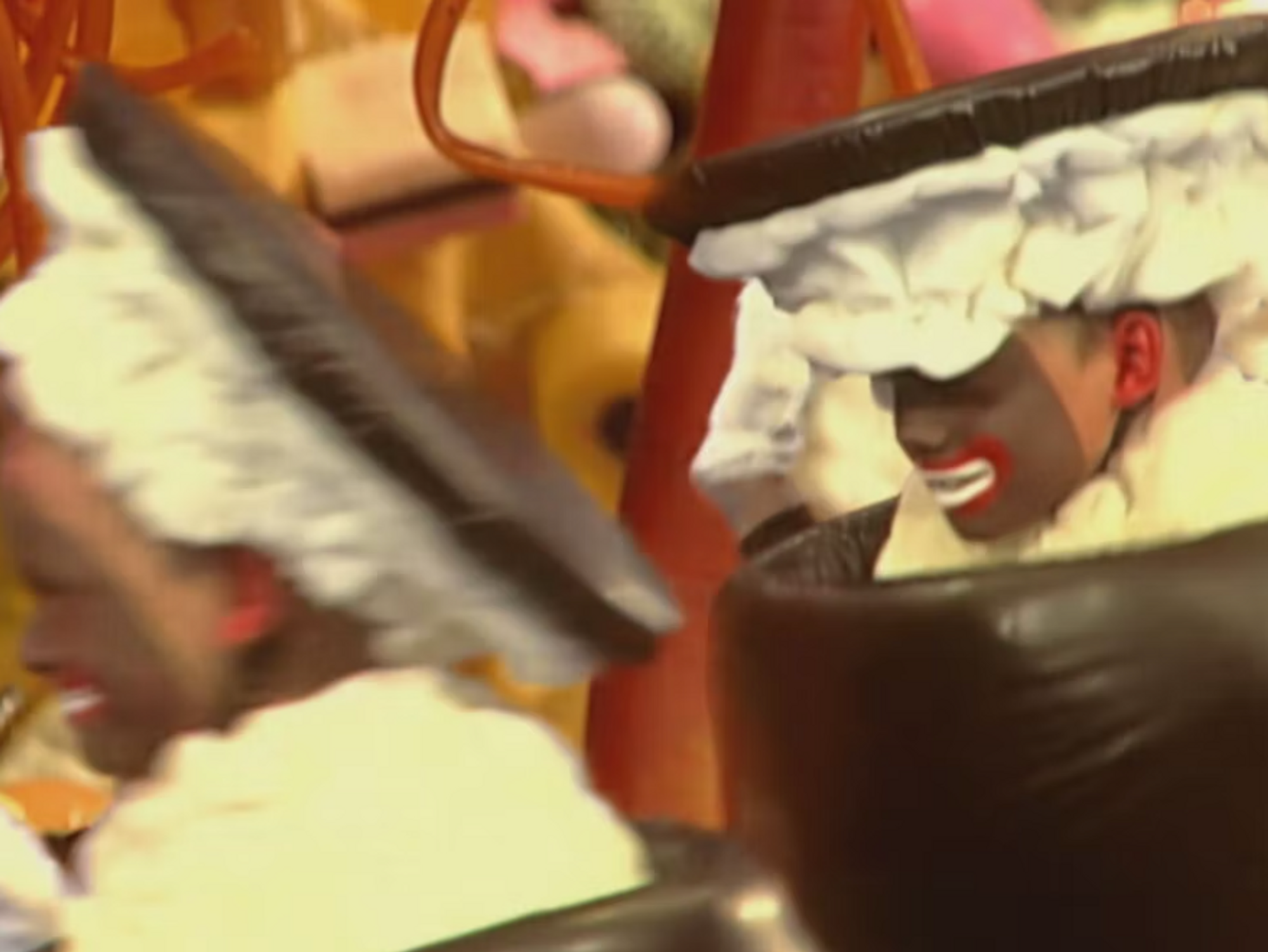 Screenshot of a child wearing apparent blackface as part of a vintage "TV Christmas calendar" episode on Danish TV