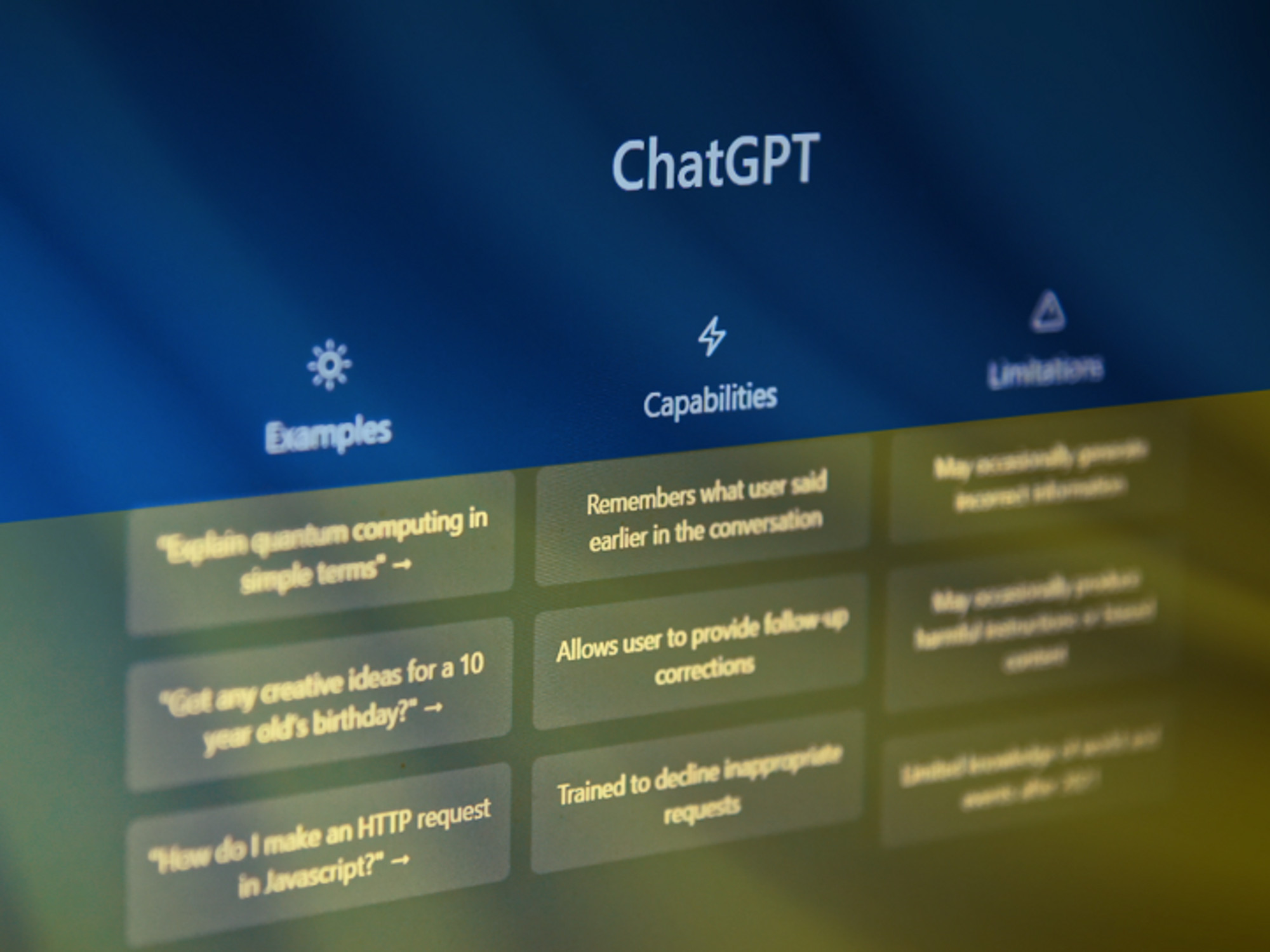 Screenshot of OpenAI's ChatGPT homepage with a flag of Ukraine in the background