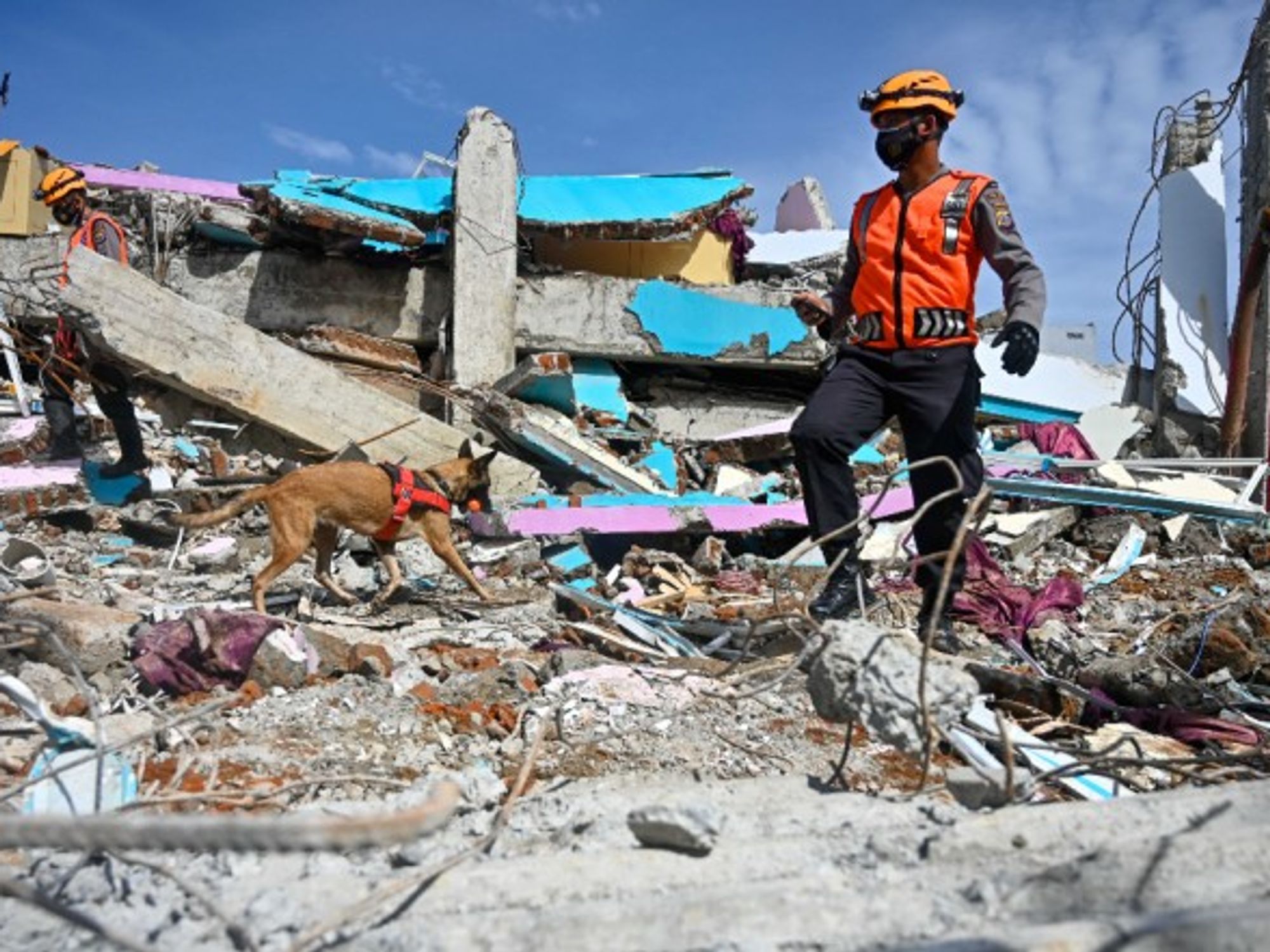 Searching for victims in the rubble in Mamuju after the Indonesian island of Sulawesi was hit by a 6.2 magnitude earthquake on Jan. 15, killing at least 81.