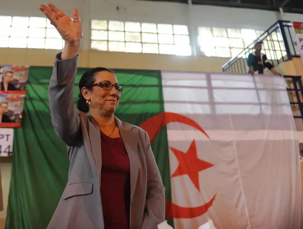 Secretary General of the Workers' Party (PT) Louisa Hanoune waves.​