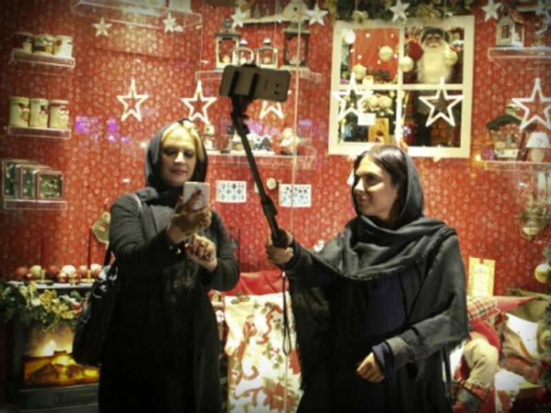 Selfie sticks and holiday cheer in Tehran in December