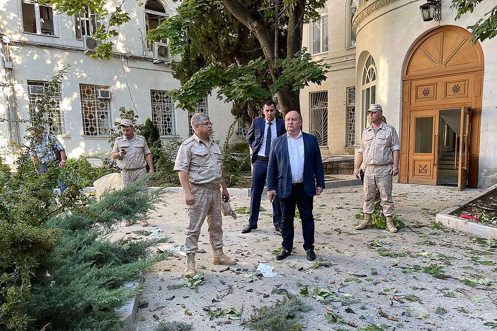 Sevastopol Governor Mikhail Razvozhayev is seen outside the Russian Black Sea Fleet headquarters