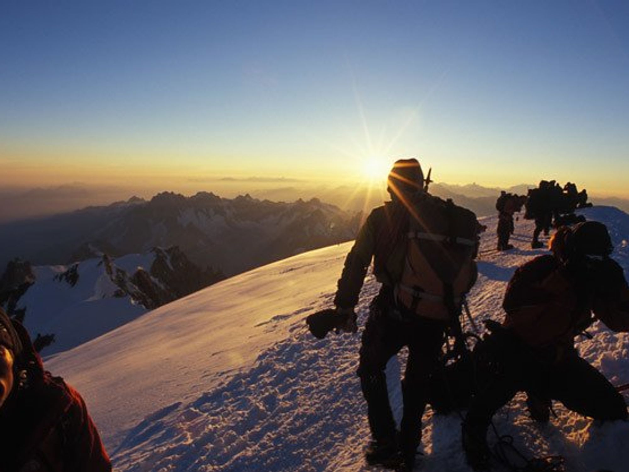 several people at the summit of Mont Blanc