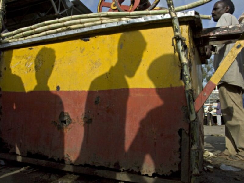 Shadows of workers in Bangalore, India