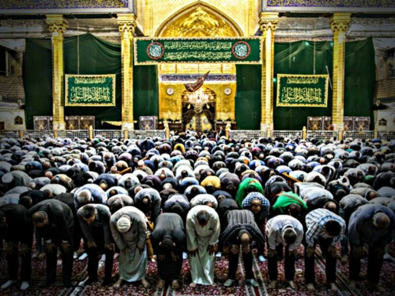 Shias holding their evening prayer in the holy sites of Karbala, Iraq