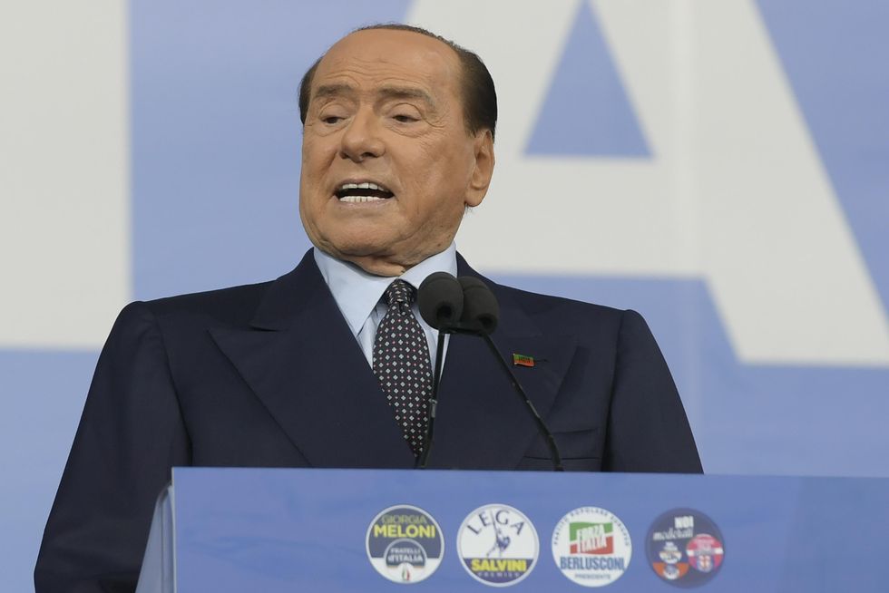 Silvio Berlusconi attends at the rally closing the election campaign of the center right in Piazza del Popolo