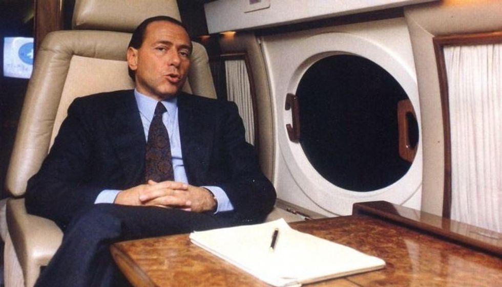 Silvio Berlusconi in a plane in the 1980s.