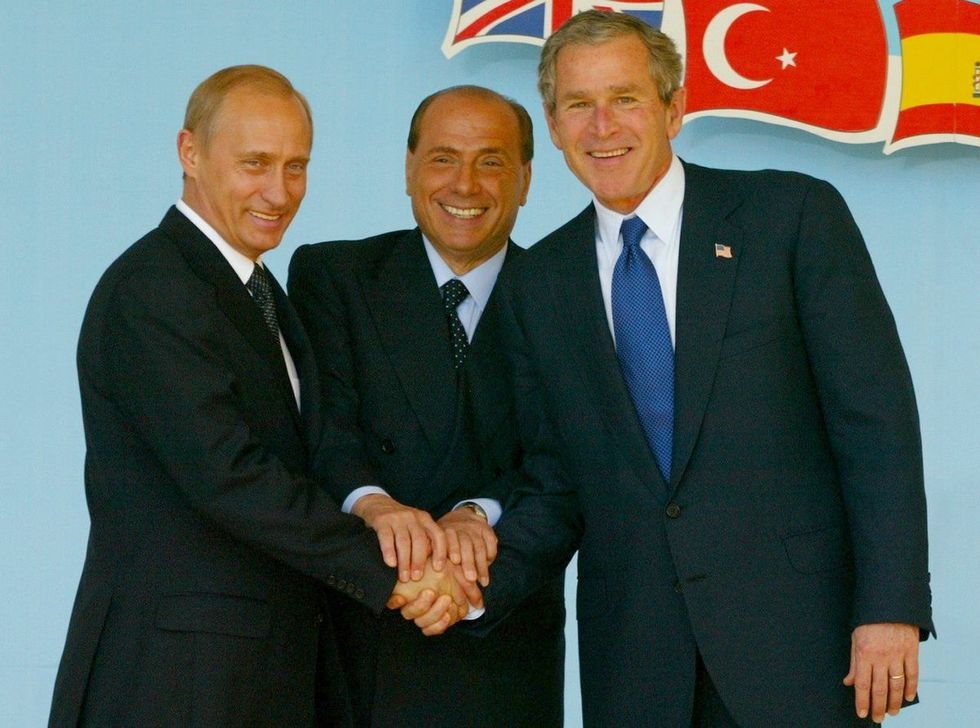Silvio Berlusconi with Vladimir Putin and George W. Bush after signing the Rome Declaration, 2002.