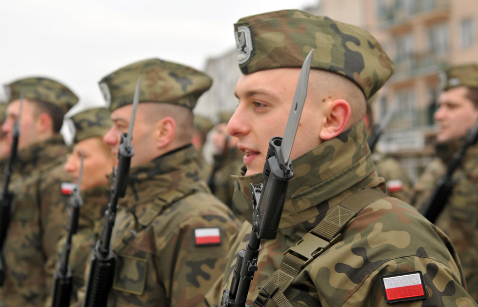 Skwierzyna, Poland. Polish Soldiers (Air Defense) singing the Polish National Anthem during a celebration ceremony in 2017.