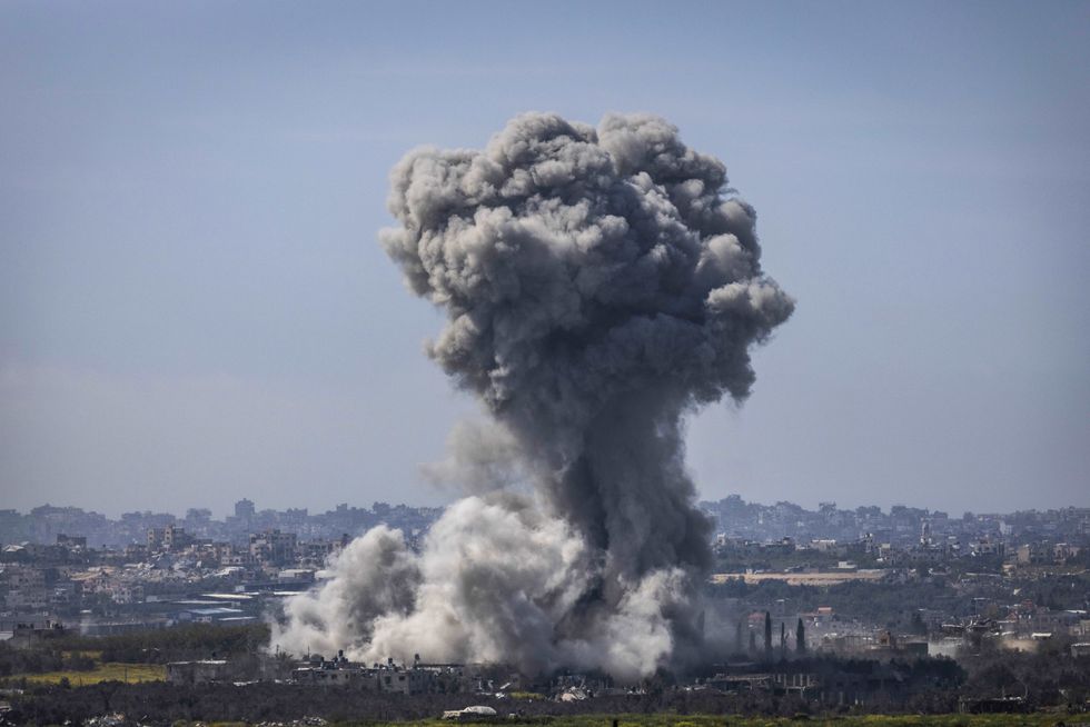 Smoke billows from an explosion on the Israel-Gaza border, as seen from Sderot, israel on March 13, 2024.