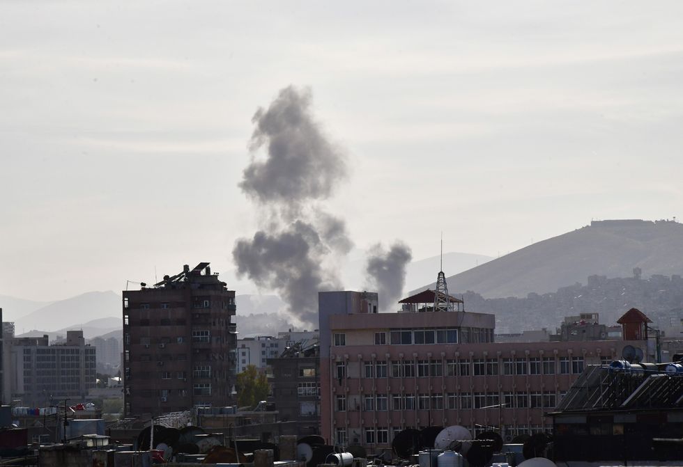 Smoke rises after an Israeli missile attack targeting the building of the Iranian Consulate.