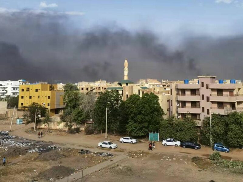 smoke rises over buildings in Khartoum