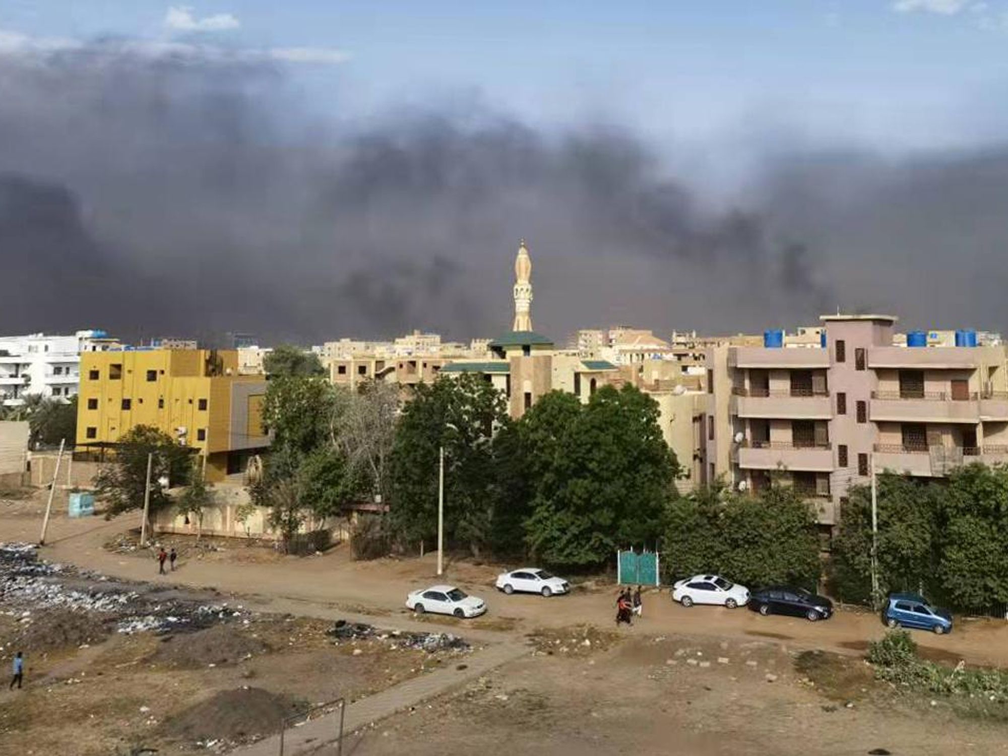 smoke rises over buildings in Khartoum