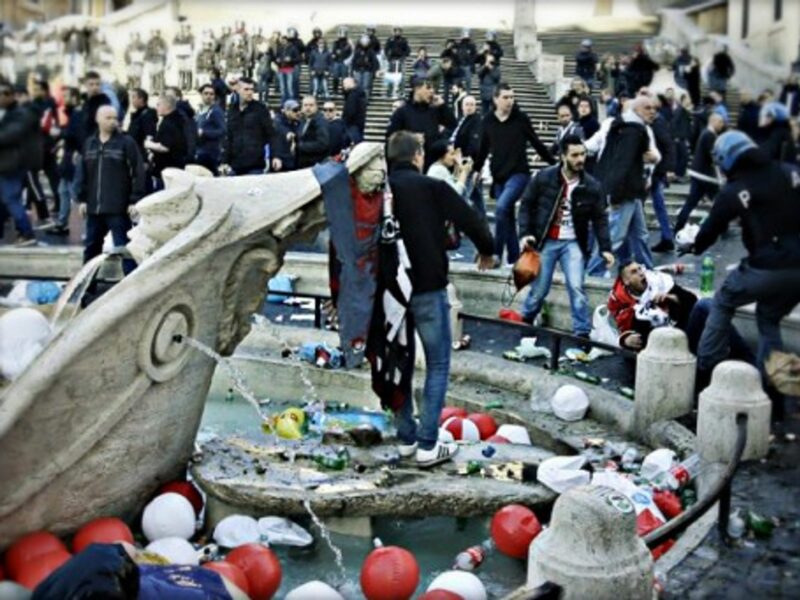 Soccer fans clash with police forces next to Rome's Fontana della Barcaccia