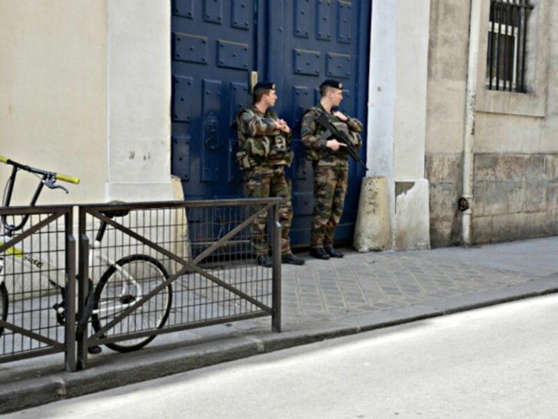 Soldiers guard the entrance of a synagogue in Paris