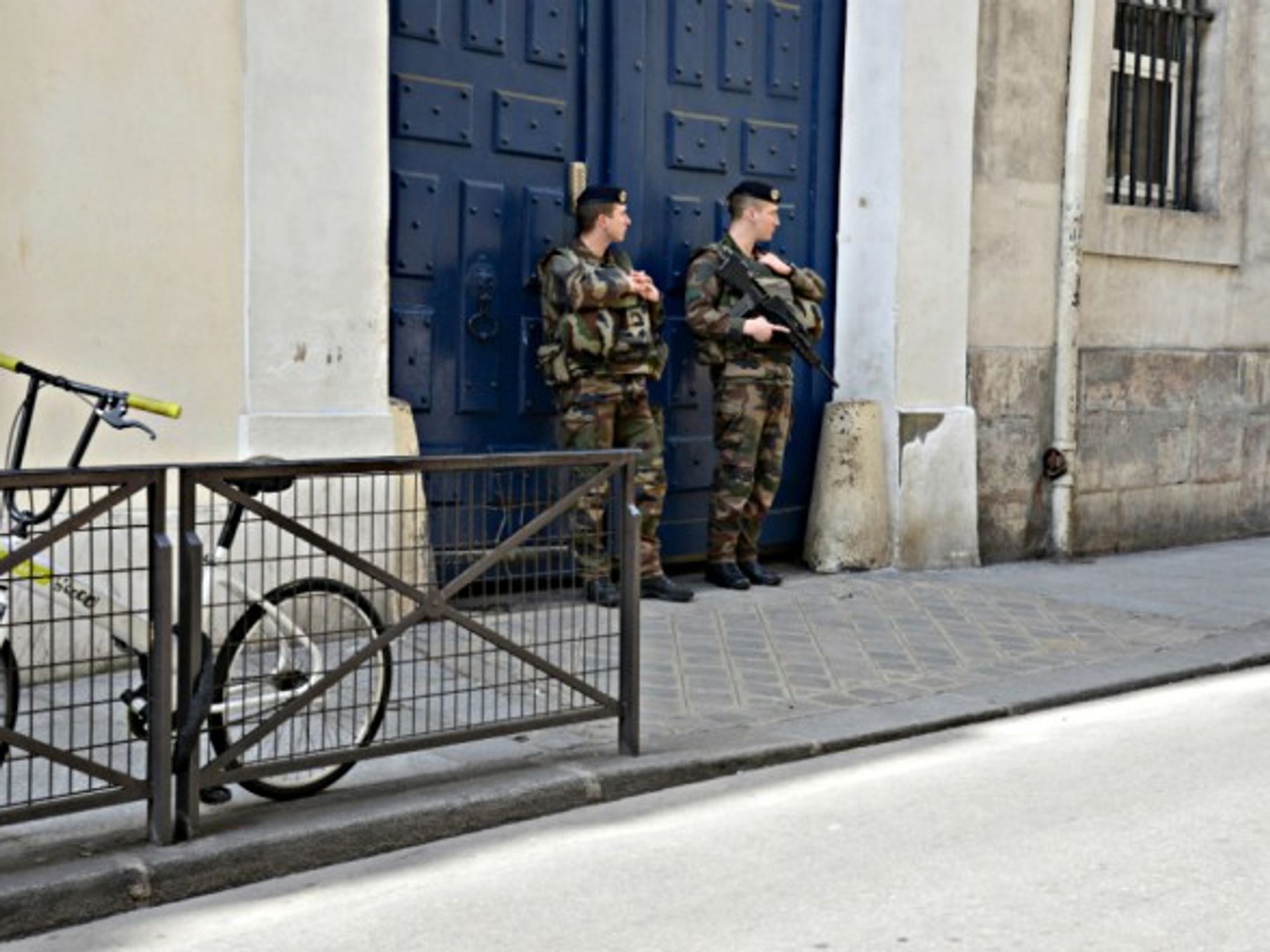 Soldiers guard the entrance of a synagogue in Paris