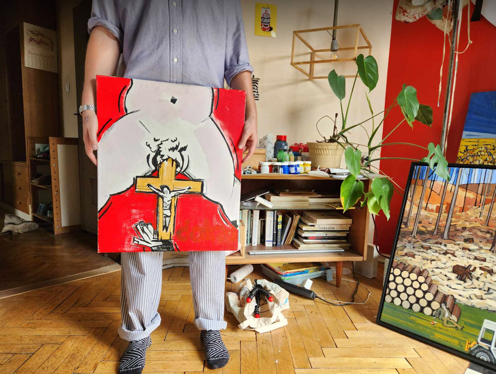 Soroka holding his painting.