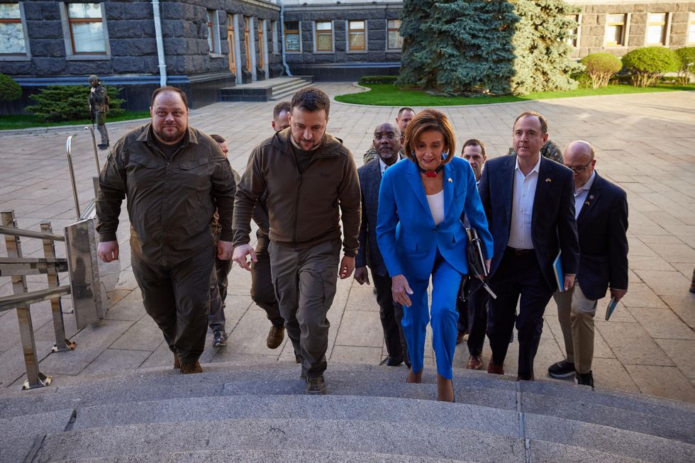 Speaker of the U.S. House of Representatives Nancy Pelosi, right, is escorted by Ukrainian President Volodymyr Zelensky