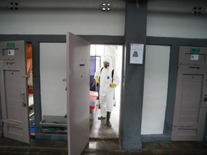 Spraying disinfectant in an Indonesian jail