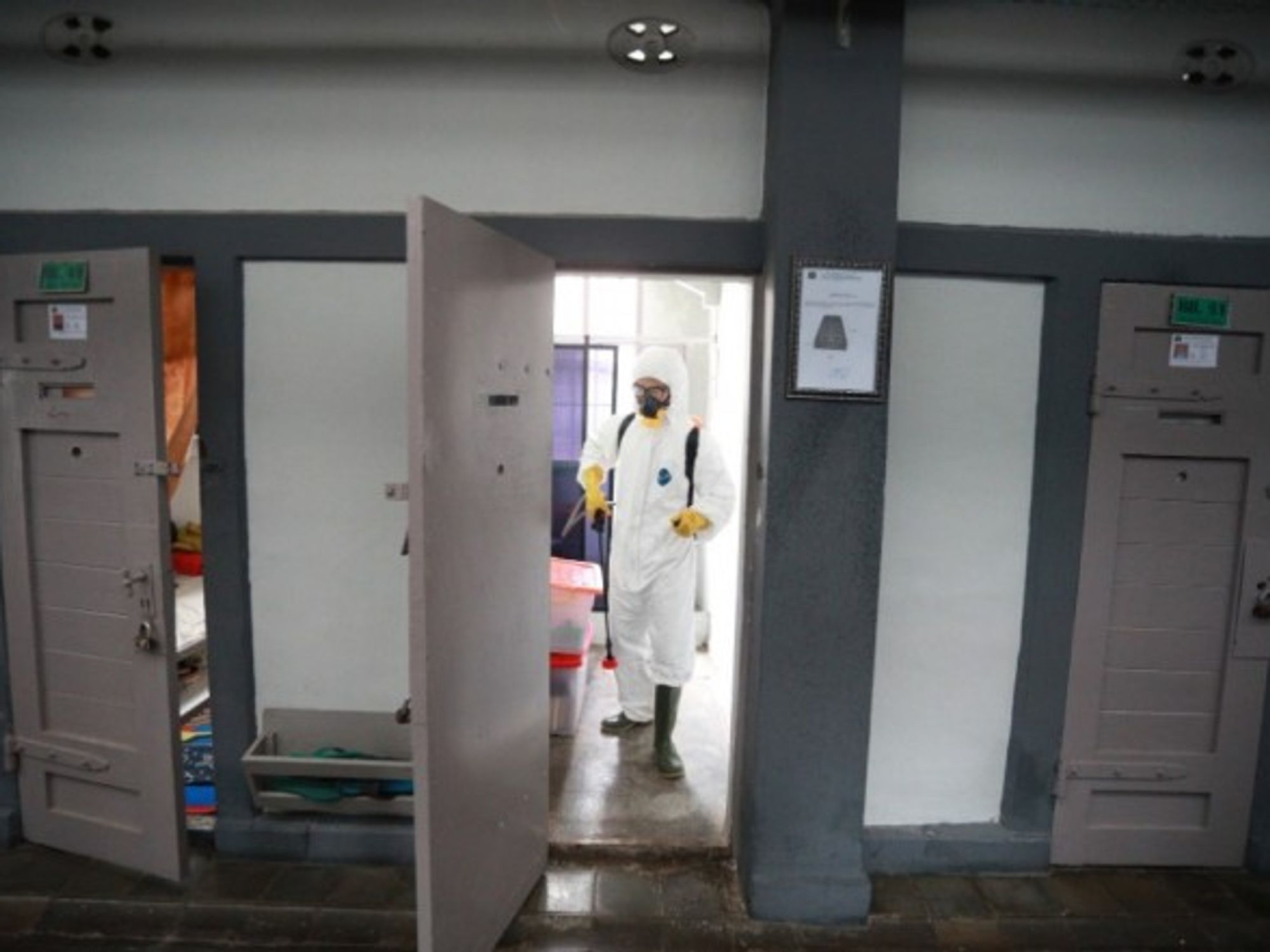 Spraying disinfectant in an Indonesian jail