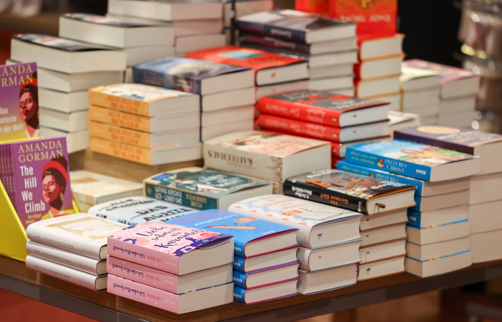 Stacks of books lie on the book tables of a Leipzig bookshop