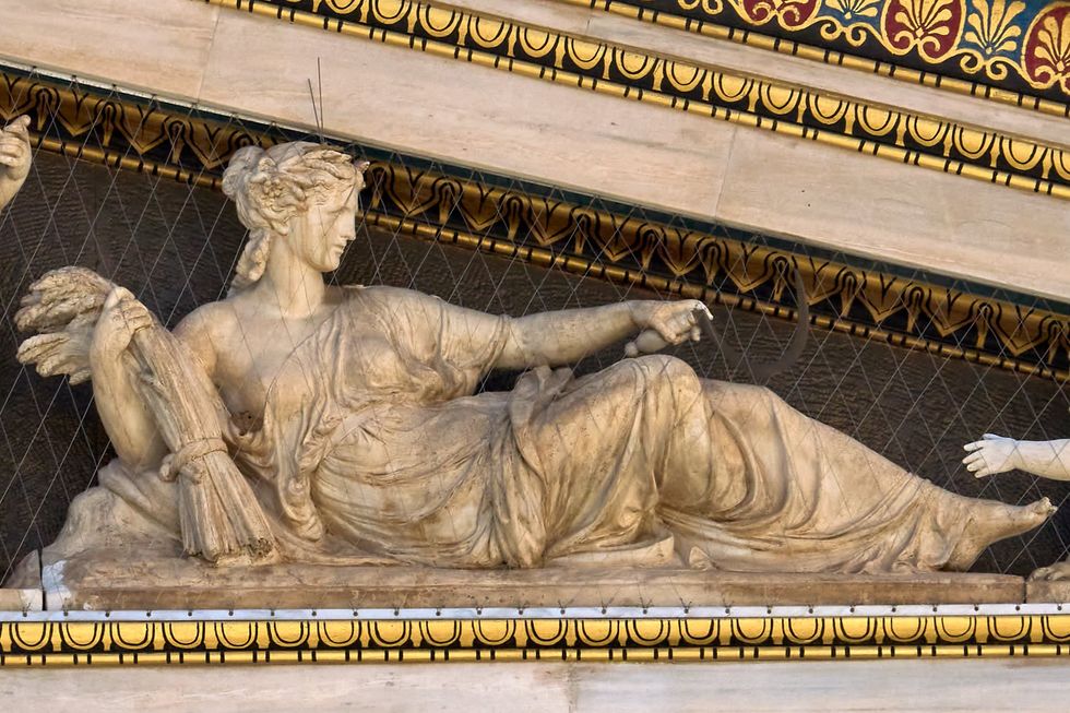 Statue of Demeter by Leonidas Drosis in the façade of the Academy of Athens, Greece.​