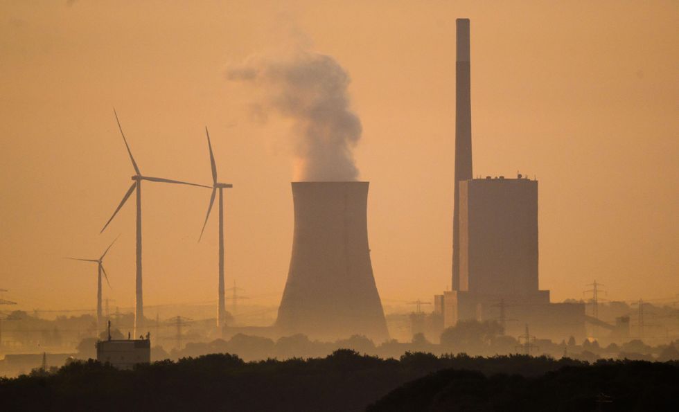 Steam rises from the cooling tower of the Mehrum power plant