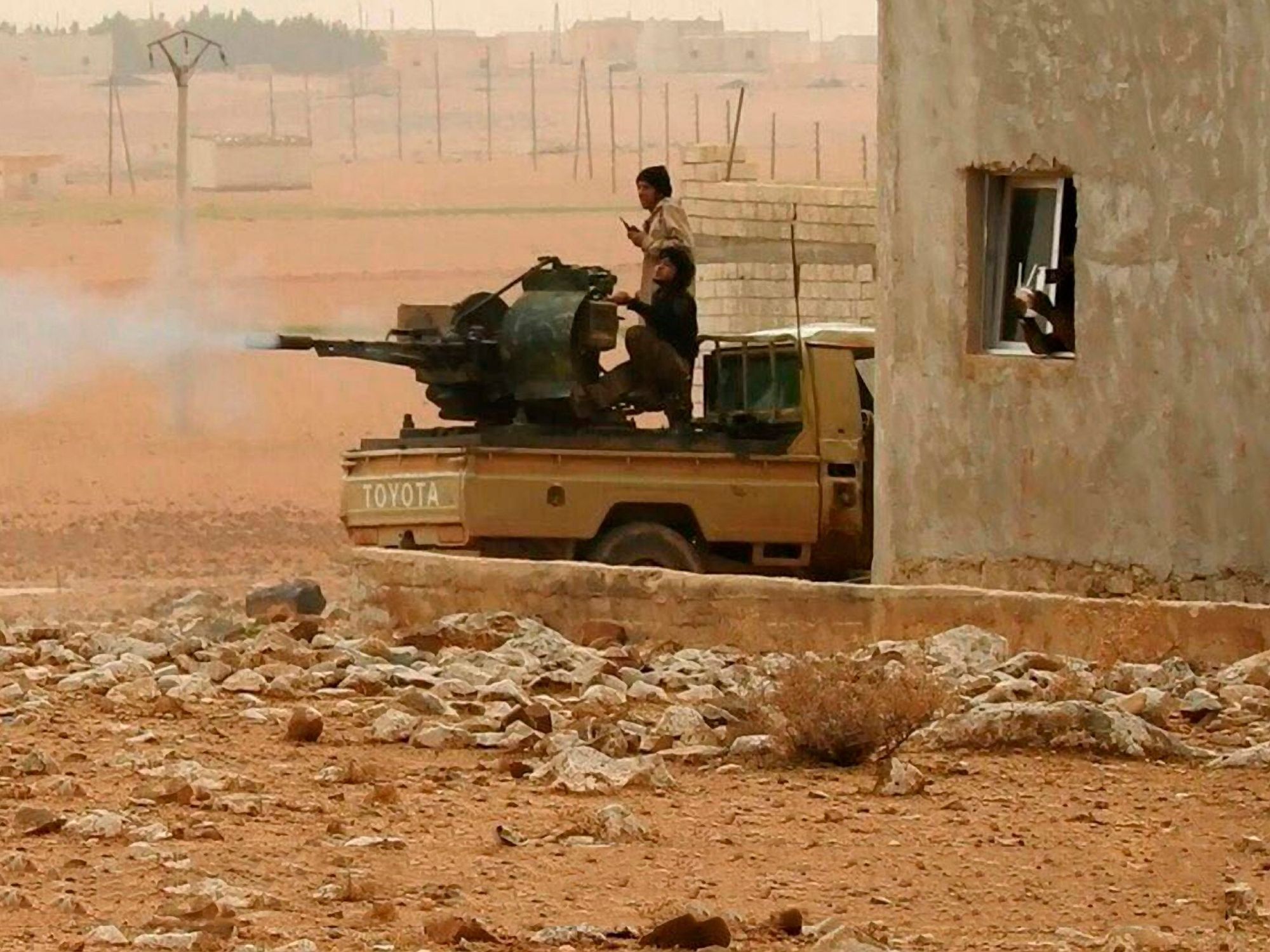 Still image taken from a propaganda video released January 18, 2018 showing Islamic State fighters firing heavy weapons against the Syrian Army near Hama, Syria.