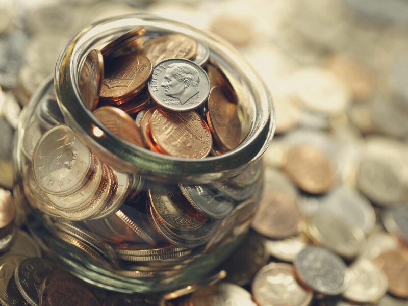 Stock photo of a jar filled with coins