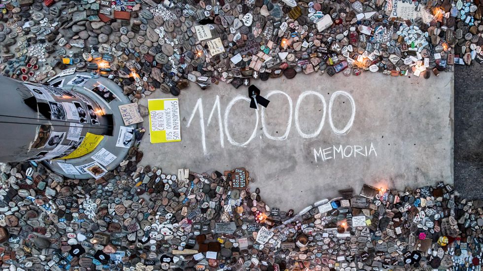 Stones left from the "march of the stones" tribute on Aug. 16, 2021, to victims of Covid-19 at the Plaza de Mayo in Buenos Aires, Argentina. Each stone is meant to represent someone who died from Covid-19.