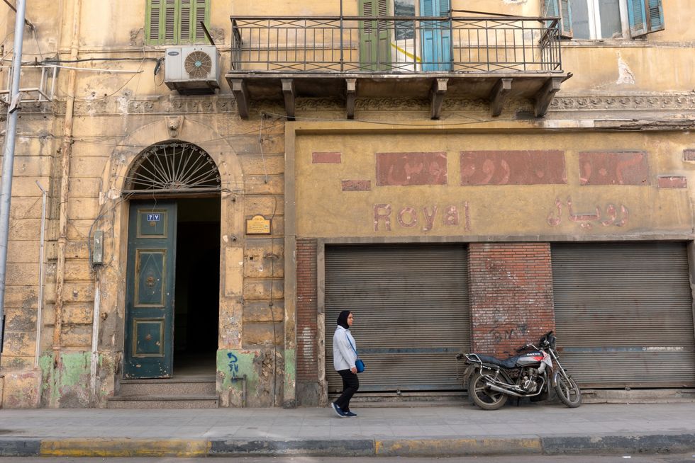 Street scene and typical faded architecture of the Egyptian historical city of Alexandria.
