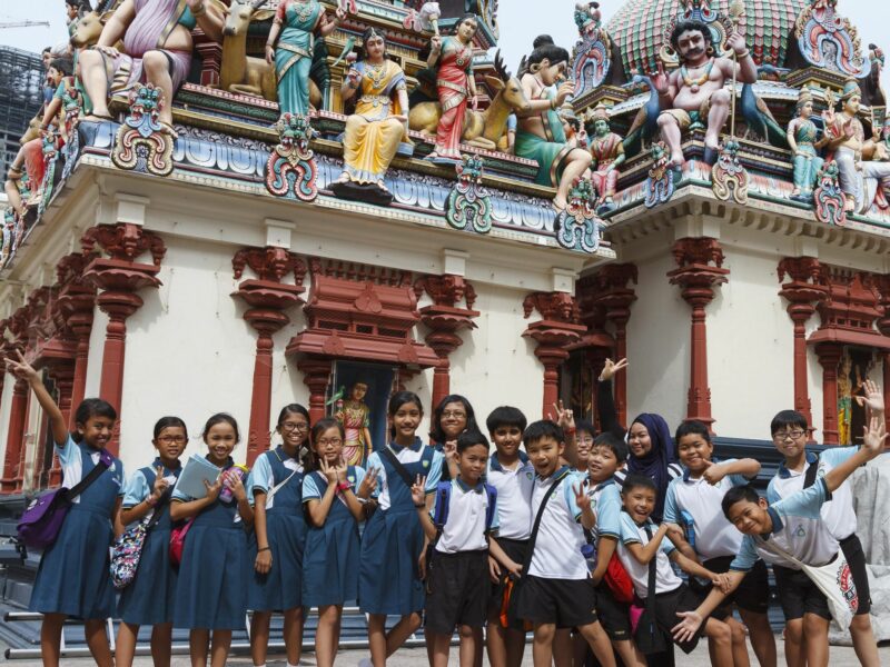 Students at Sri Mariamman Hindu temple in Singapore