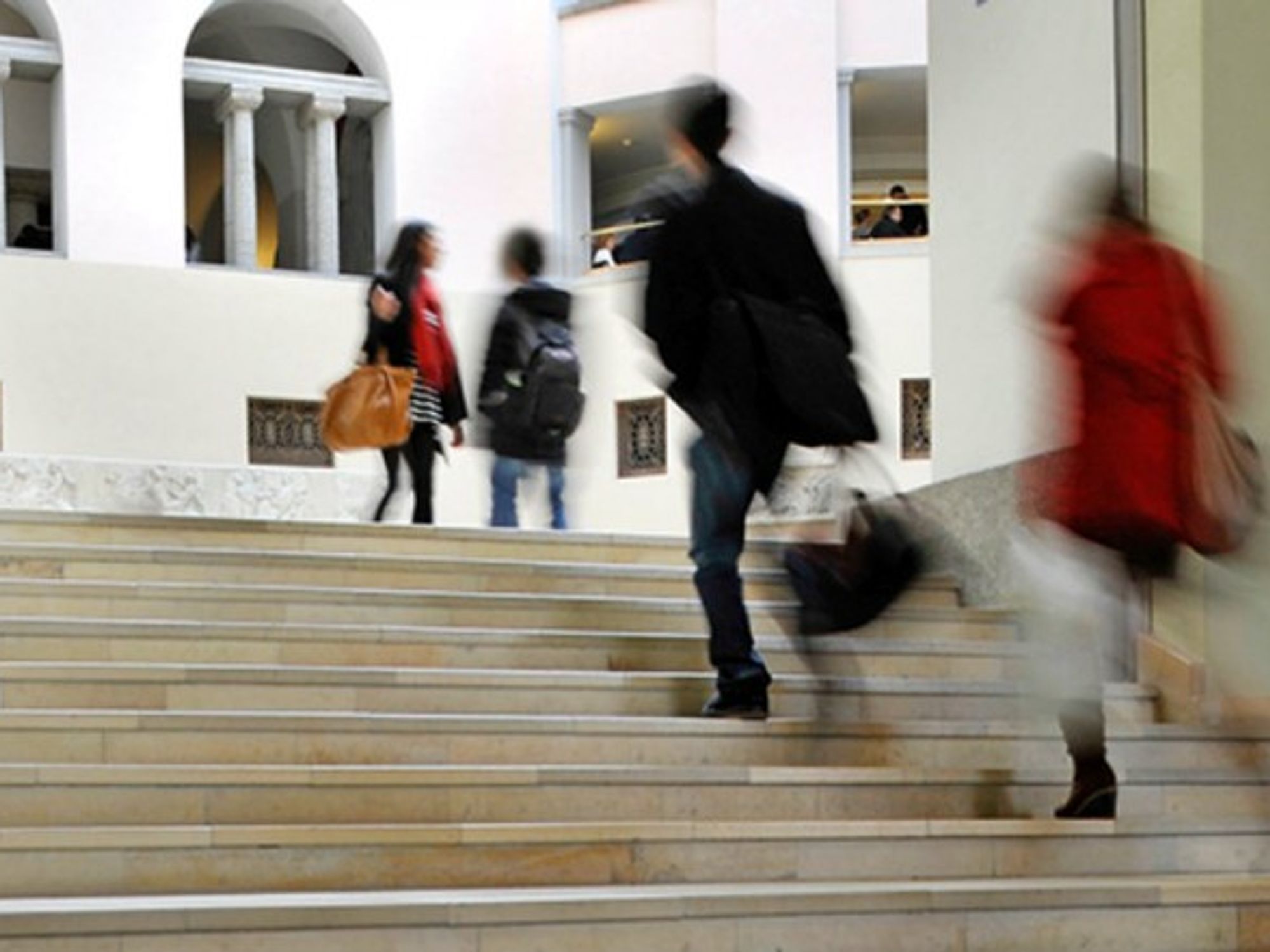 Students walk through the University of Zurich campus.