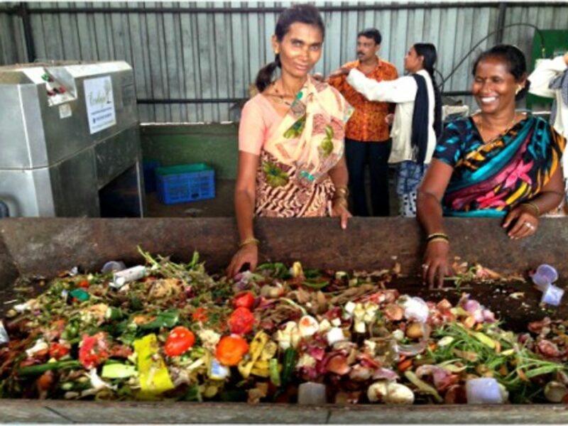 Sudjata Imtiaz Khan (right) and her friend Surekha sorting the waste
