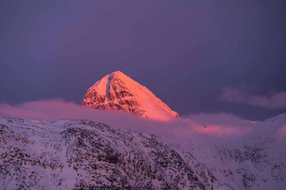 Sun sets on mountains near Greenland's capital Nuuk