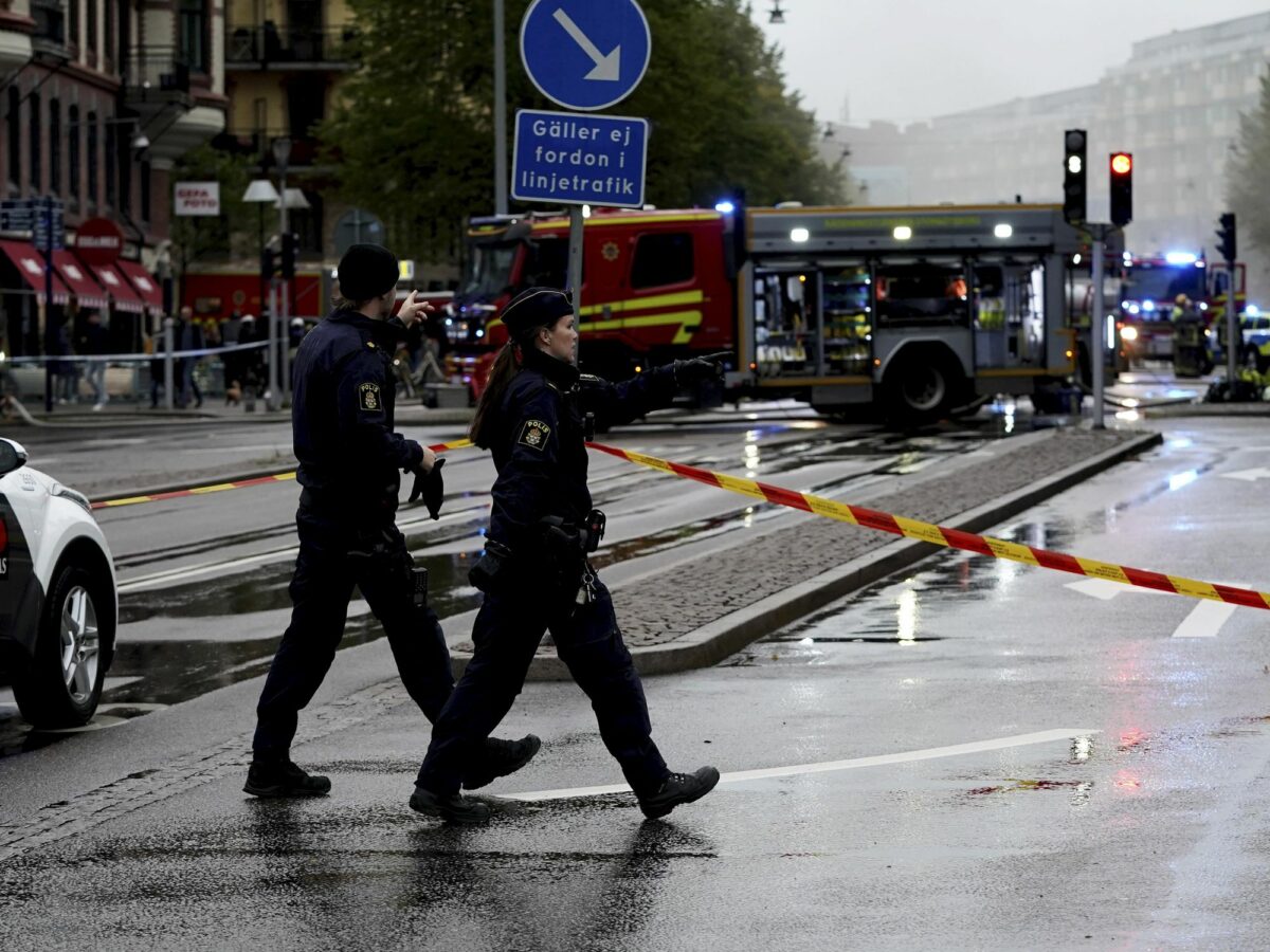 Swedish police officers walk towards a cordoned-off scene in Gothenburg, after the Sept. 28 explosion at a multi-family complex