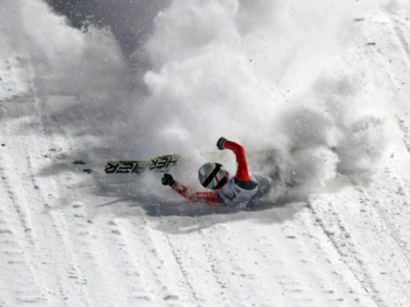Swiss champion Simon Ammann took a spectacular but harmless fall during a ski jumping event in Oberstdorf, Germany.