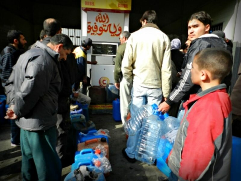 Syrian refugees queuing for gas in southern Lebanon
