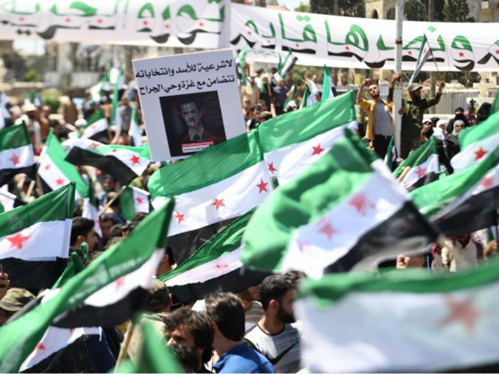 Syrians demonstrated in the city of Idlib against the presidential elections which were held this Wednesday, with Bashar al-Assad expected to win a fourth term